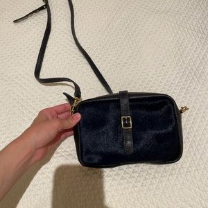 Clare V navy calf hair mini sac bag.